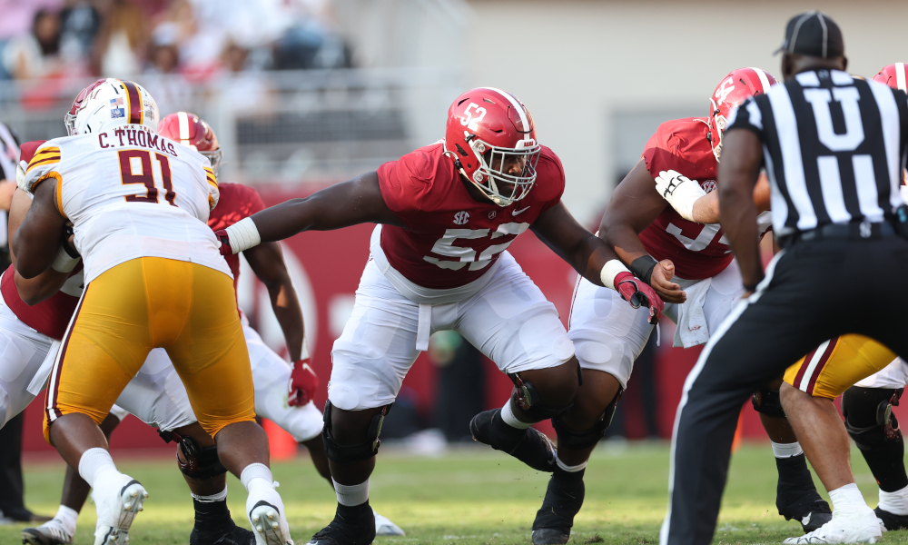 Alabama OL Tyler Booker (#52) getting reps at first-team left guard versus ULM