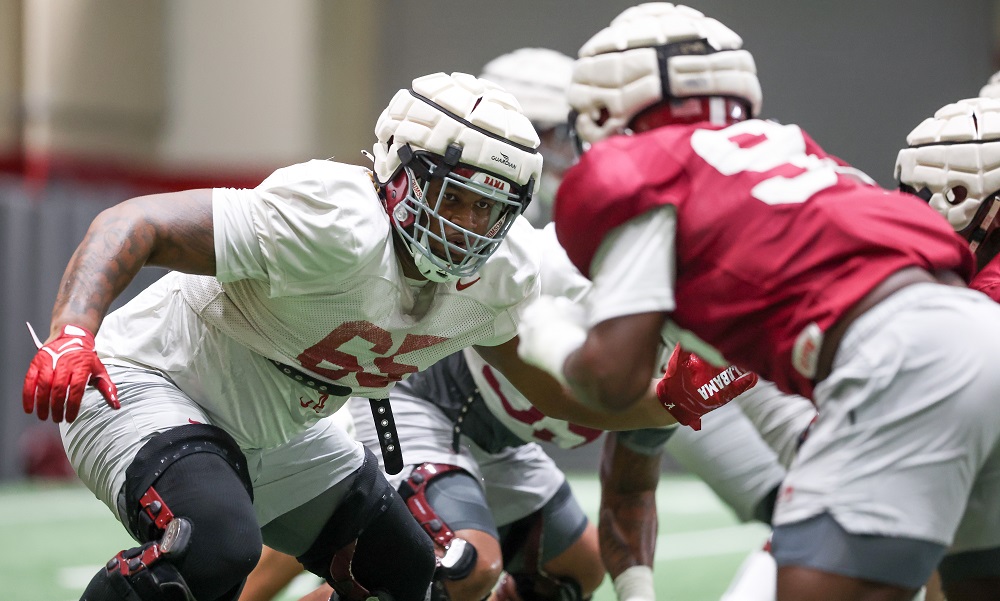 Alabama offensive lineman JC Latham (65) blocks during practice at the Hank Crisp Indoor Facility in Tuscaloosa, AL on Tuesday, Oct 25, 2022.