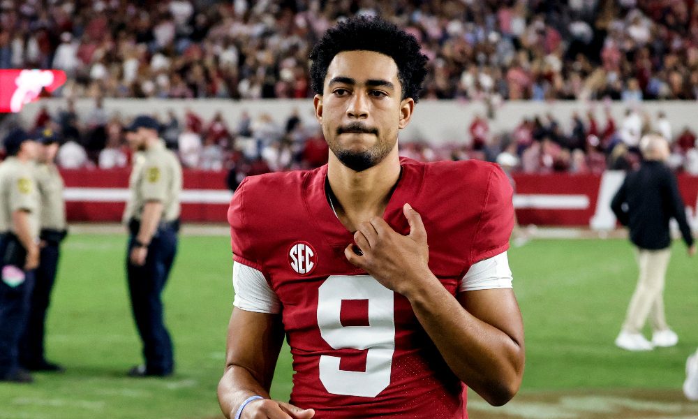 Bryce Young walks off the field against Arkansas