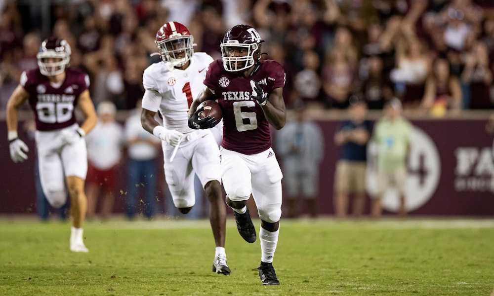 Texas A&M RB Devon Achane (#6) runs a kickoff back for a touchdown versus Alabama in 2021