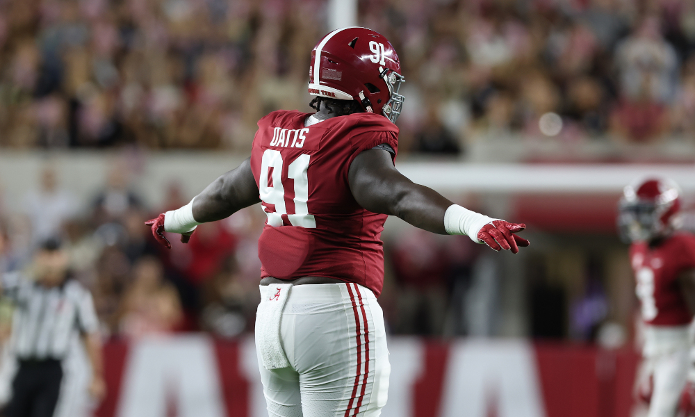 Alabama DL Jaheim Oatis (#91) signals a call during first half against Texas A&M