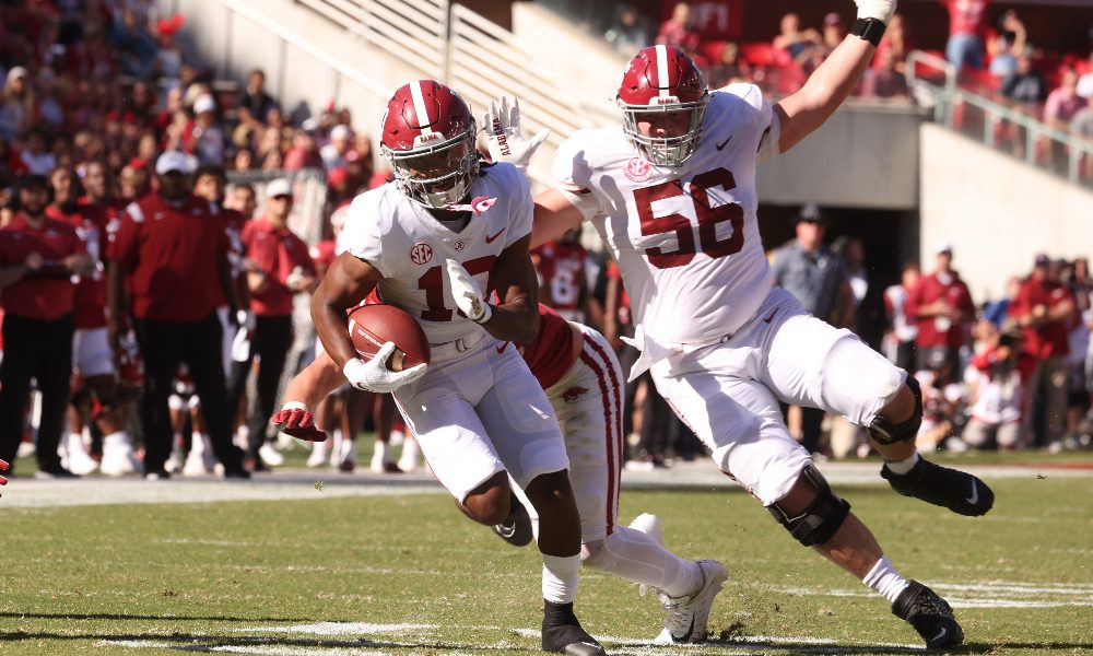 Jahmyr Gibbs breaks away for a run with Seth McLaughlin behind him