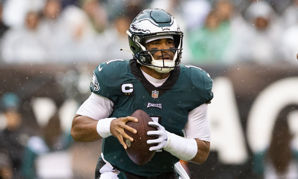Jalen Hurts (#1) has the ball attempting to pass for Eagles versus Jaguars in 2022