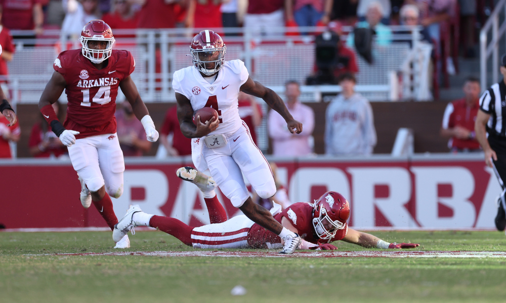 Alabama QB Jalen Milroe (#4) runs for 75 yards against Arkansas defense