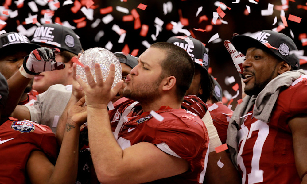 Nick Gentry kissing 2011 BCS National Championship trophy for Alabama after victory over LSU