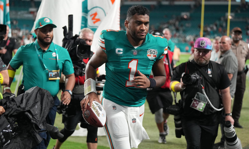 Dolphins' QB Tua Tagovailoa (#1) comes off the field into the tunnel after Sunday's victory over Steelers