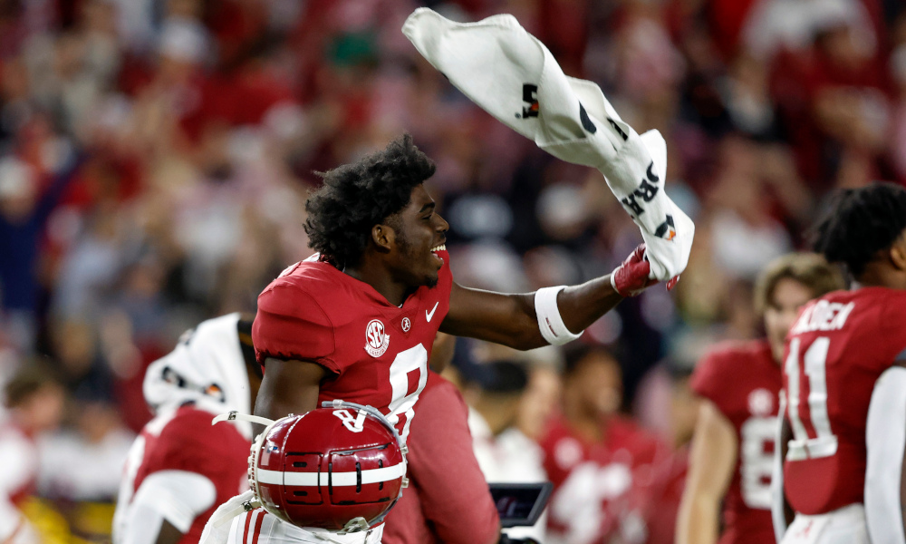 Alabama WR Tyler Harrell (#8) celebrating with a towel on the sideline during 2022 game versus Texas A&M