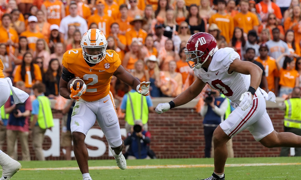 Oct 15, 2022; Knoxville, Tennessee, USA; Tennessee Volunteers running back Jabari Small (2) runs the ball against Alabama Crimson Tide linebacker Henry To'oTo'o (10) during the first half at Neyland Stadium. Mandatory Credit: Randy Sartin-USA TODAY Sports