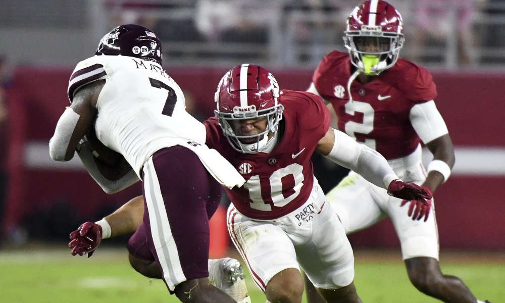 Oct 22, 2022; Tuscaloosa, Alabama, USA; Alabama Crimson Tide linebacker Henry To'o To'o (10) makes a tackle against Mississippi State Bulldogs running back Jo'quavious Marks (7) during the first half at Bryant-Denny Stadium. Mandatory Credit: Gary Cosby Jr.-USA TODAY Sports