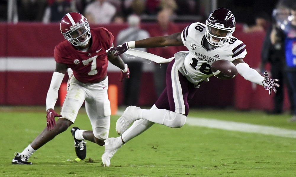 Oct 22, 2022; Tuscaloosa, Alabama, USA; Mississippi State Bulldogs wide receiver Justin Robinson (18) reaches for a pass against Alabama Crimson Tide defensive back Eli Ricks (7) at Bryant-Denny Stadium. Alabama won 30-6. Mandatory Credit: Gary Cosby Jr.-USA TODAY Sports