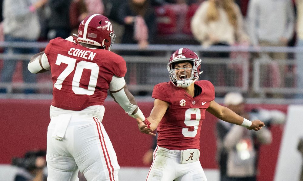 Bryce Young celebrates with Javion Cohen in the Iron Bowl