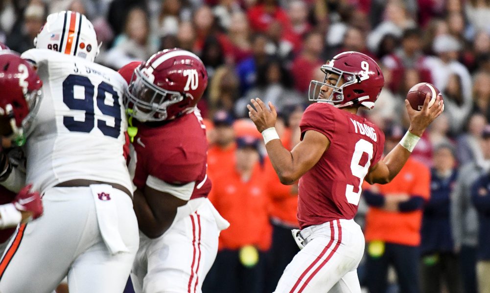 Bryce Young drops back to pass against Auburn