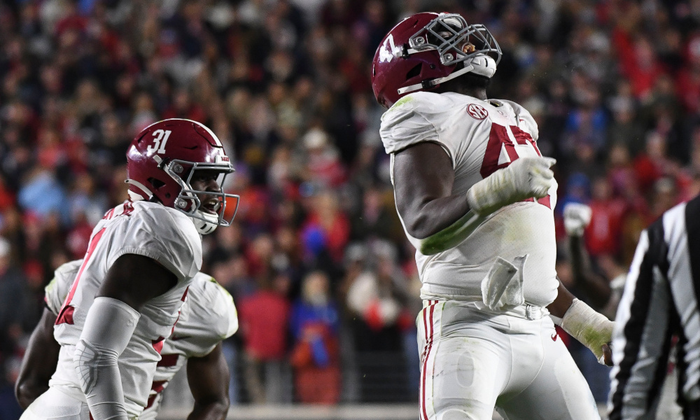Alabama DE Byron Young (#47) celebrates a sack of Ole Miss' QB Jaxson Dart in 2022 matchup between Alabama and Mississippi