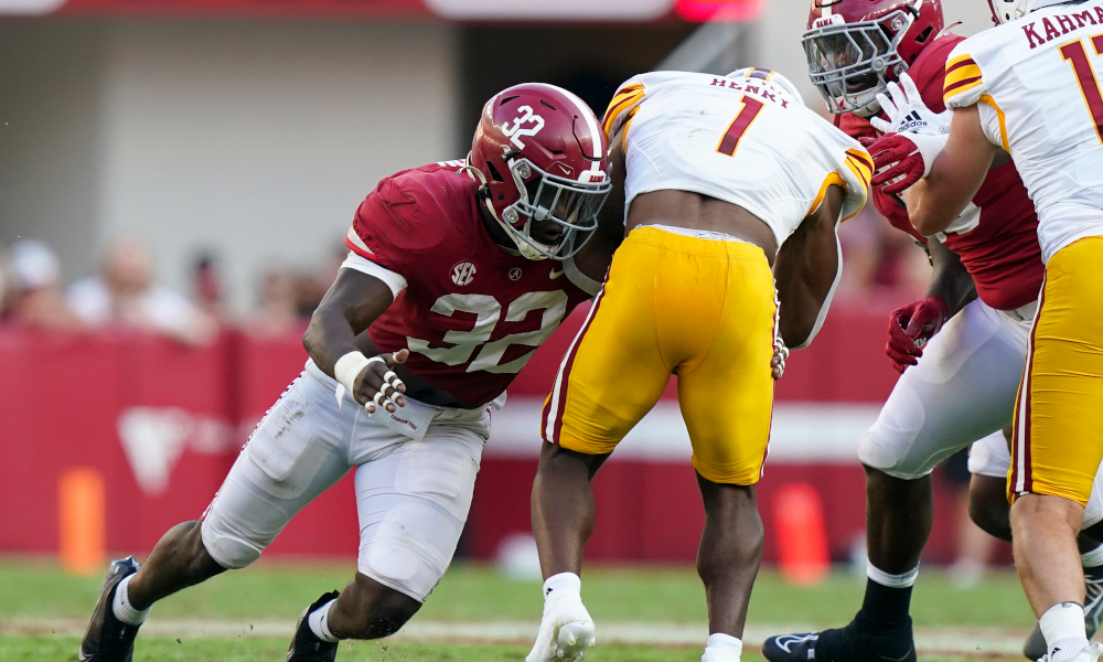 Alabama LB Deontae Lawson (#32) tackles ULM's running back in 2022 matchup