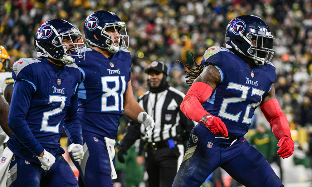 Derrick Henry (#22) celebrates after scoring a touchdown for the Titans in Thursday's game versus the Packers