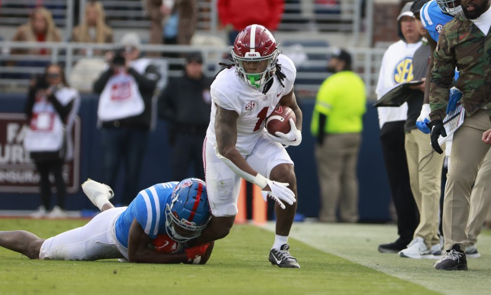 Jahmyr Gibbs tackled on the sidelines against Ole Miss