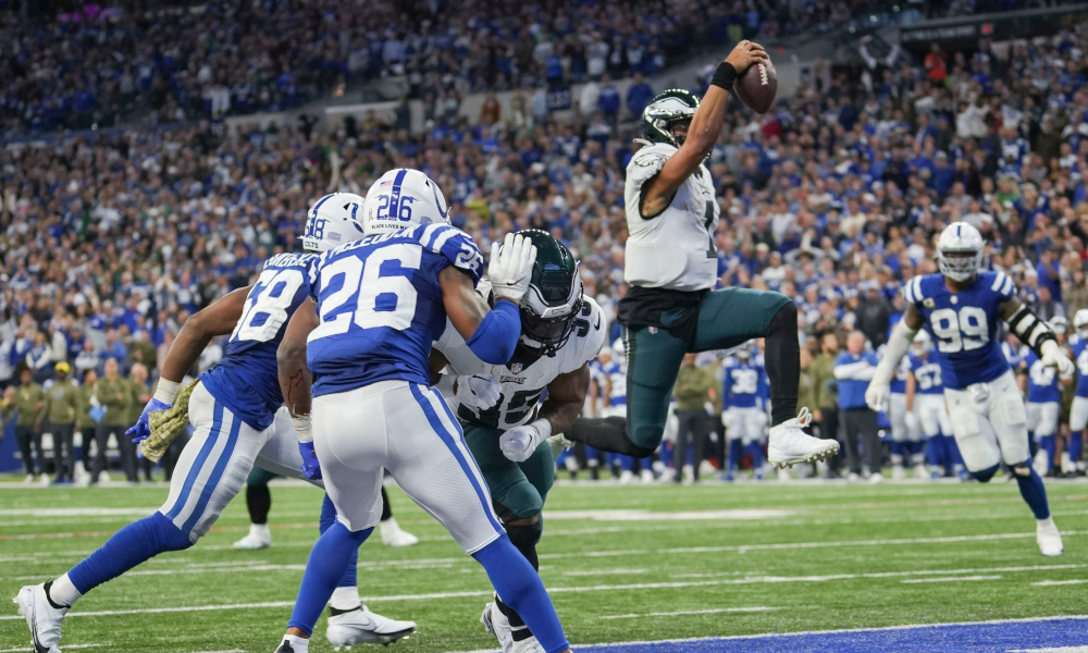 Jalen Hurts (#1) rushes in the ball for an Eagles touchdown in 2022 matchup against the Indianapolis Colts