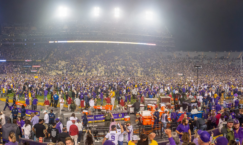 LSU fans storm of the field after defeating Alabama