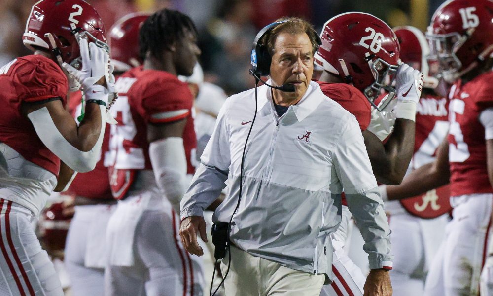 Nick Saban walks the sidelines