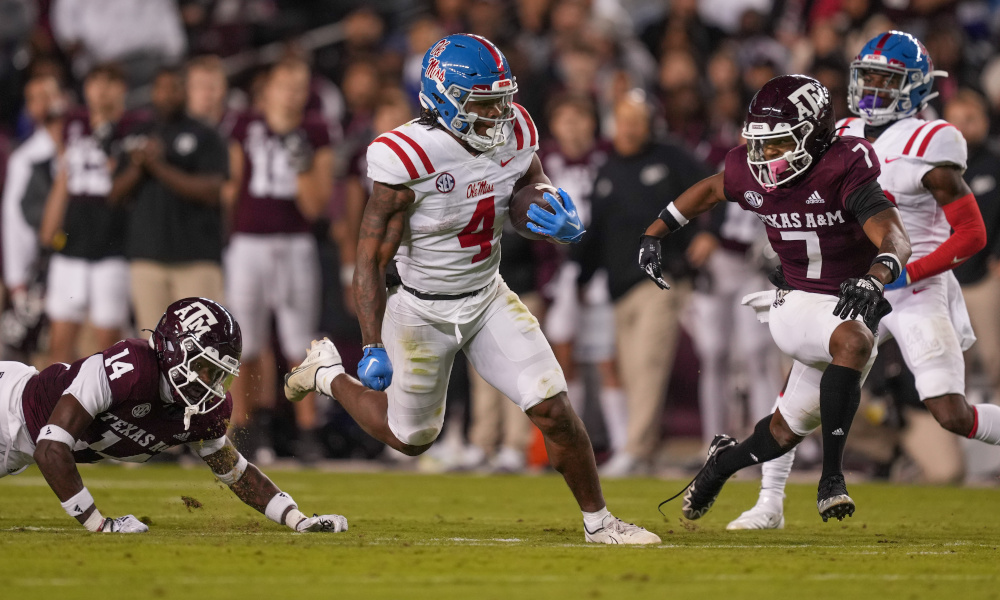 Ole Miss running back Quinshon Judkins (#4) runs the ball against Texas A&M in matchup with Aggies.