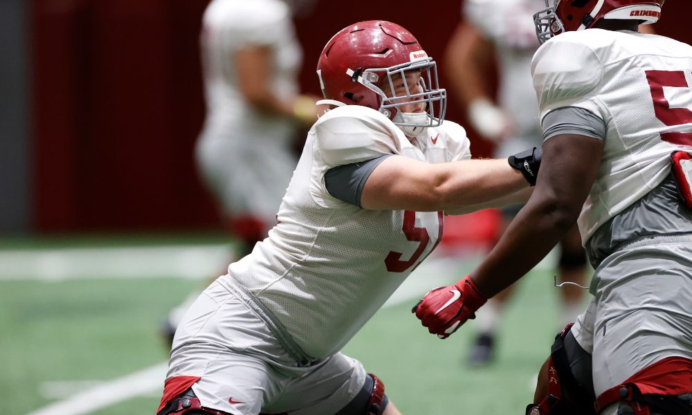 Tanner Bowles throws a block at practice