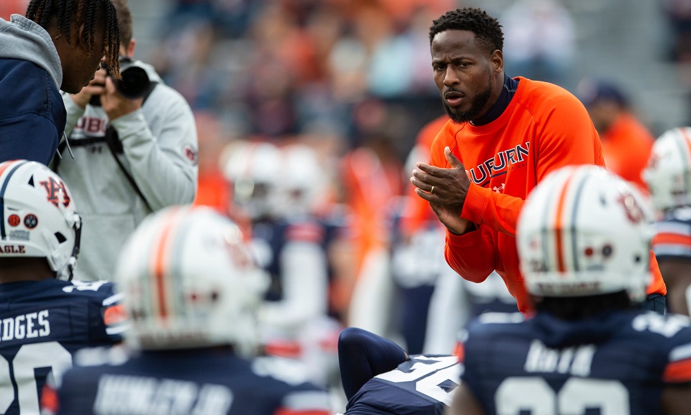 Auburn Tigers interim head coach Carnell Williams encourages his team during warm ups before Auburn Tigers take on Western Kentucky Hilltoppers at Jordan-Hare Stadium in Auburn, Ala., on Saturday, Nov. 19, 2022.