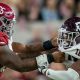 Alabama offensive tackle JC Latham (#65) blocks Texas A&M's DL Fadil Diggs (#10) during 2022 matchup
