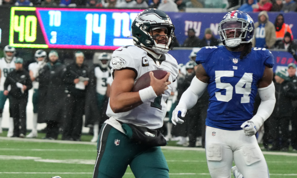 Eagles' quarterback Jalen Hurts (#1) runs in for a touchdown in the second half against the New York Giants in Sunday's 48-22 victory for Philadelphia.