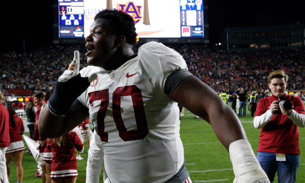 Alabama OL Javion Cohen (#70) quiets Auburn crowd at Jordan-Hare Stadium in 2021 Iron Bowl