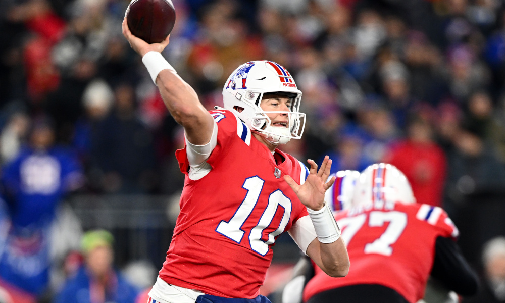 Patriots QB Mac Jones (#10) throws a pass in Thursday's matchup against Buffalo Bills.