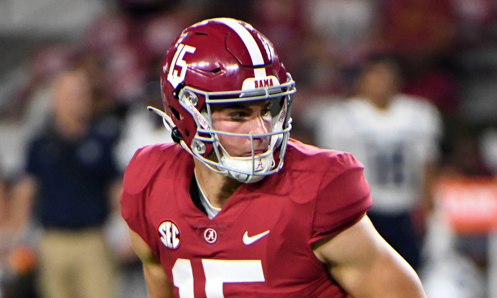 Alabama freshman QB Ty Simpson (#15) executes a hand off against Utah State at Bryant-Denny Stadium for 2022.