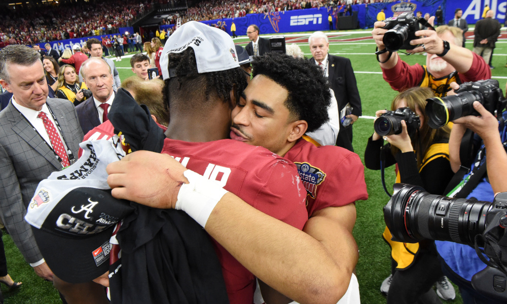 Alabama quarterback Bryce Young (#9) and linebacker Will Anderson Jr. (#31) celebrate with a hug after the Crimson Tide defeats Kansas State in the Allstate Sugar Bowl.