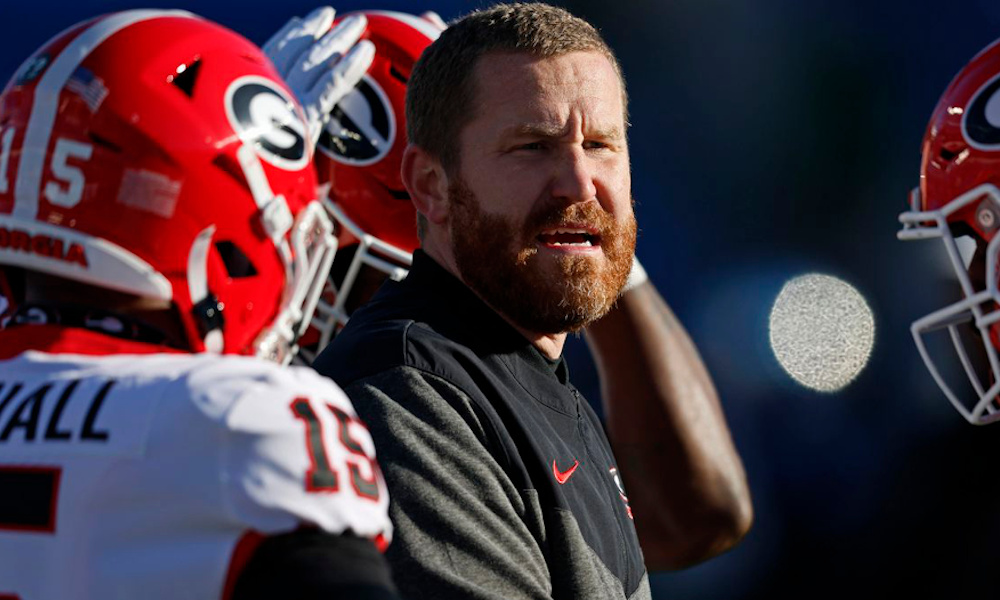 Georgia's co-defensive coordinator Glenn Schumann talking to players on the sideline during 2022 game against Kentucky.