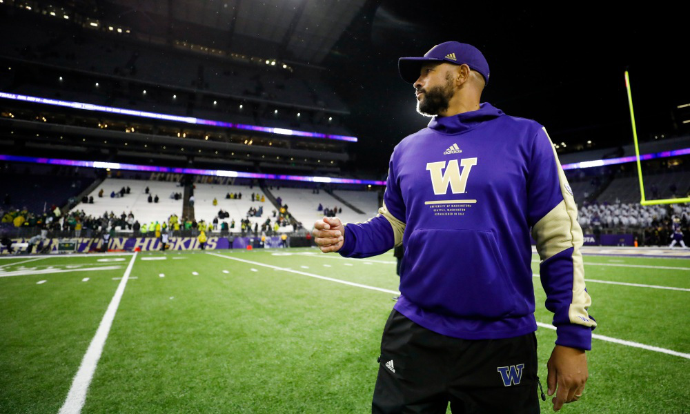 Washington head coach Jimmy Lake on the field before a game in 2021 season.