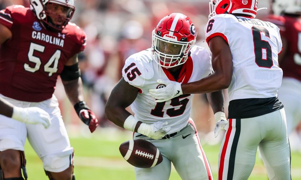 Former Georgia LB Trezmen Marshall (#15) breaks up a pass for the Bulldogs' defense versus South Carolina in 2022 matchup.