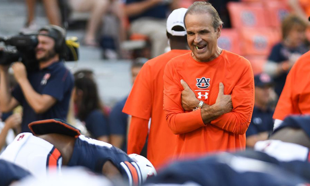 Kevin Steele warms up with Auburn players as defensive coordinator in 2018 season.