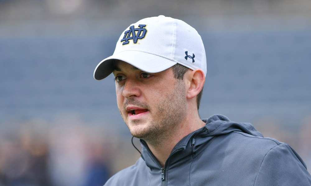 Notre Dame OC Tommy Rees on the field during 2021 season for the Irish.