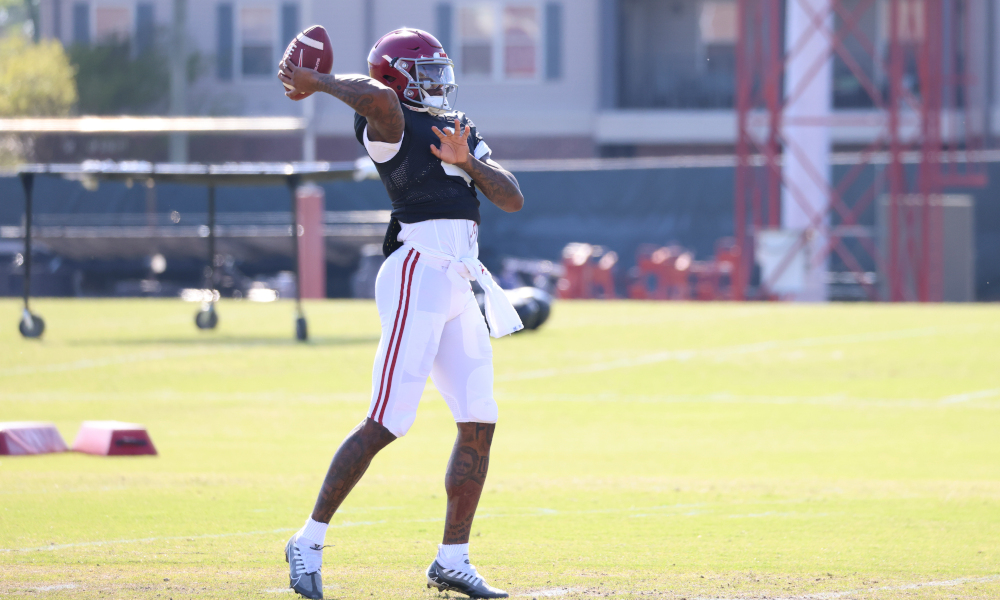 Alabama QB Jalen Milroe (#4) drops back to pass during spring practice.