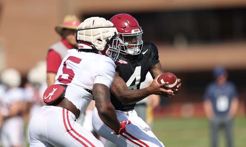 Alabama quarterback Jalen Milroe (4) hands the ball to Alabama running back Roydell Williams (5) during practice at Thomas-Drew Practice Fields in Tuscaloosa, AL on Monday, Apr 10, 2023.