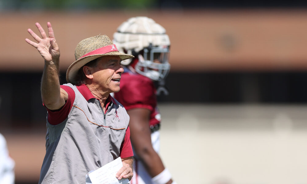 Nick Saban gives direction to the defense at practice