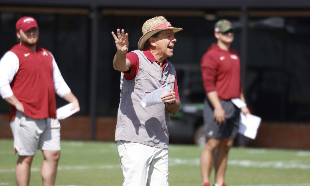 Nick Saban gives direction to the team at practice
