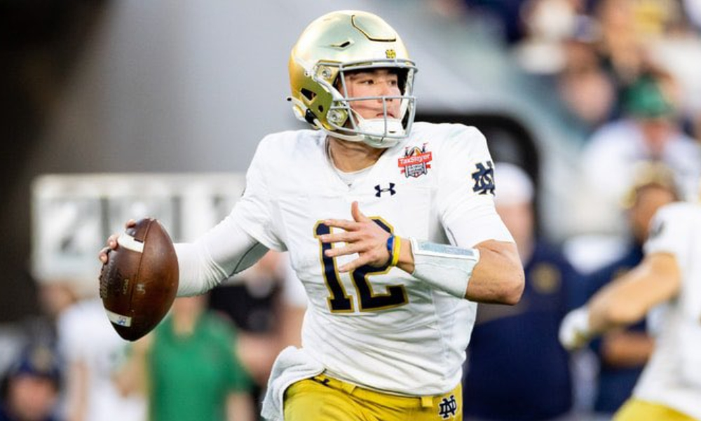 Tyler Buchner throws a pass at Notre Dame