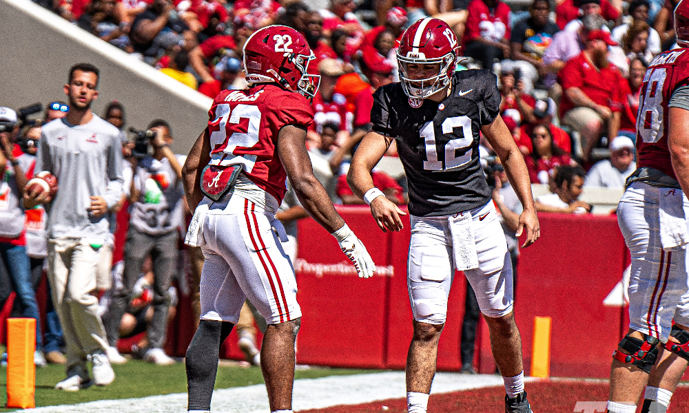 Alabama freshman QB Dylan Lonergan (#12) celebrates a TD pass to RB Justice Haynes (#22) in the Crimson Tide's spring game.