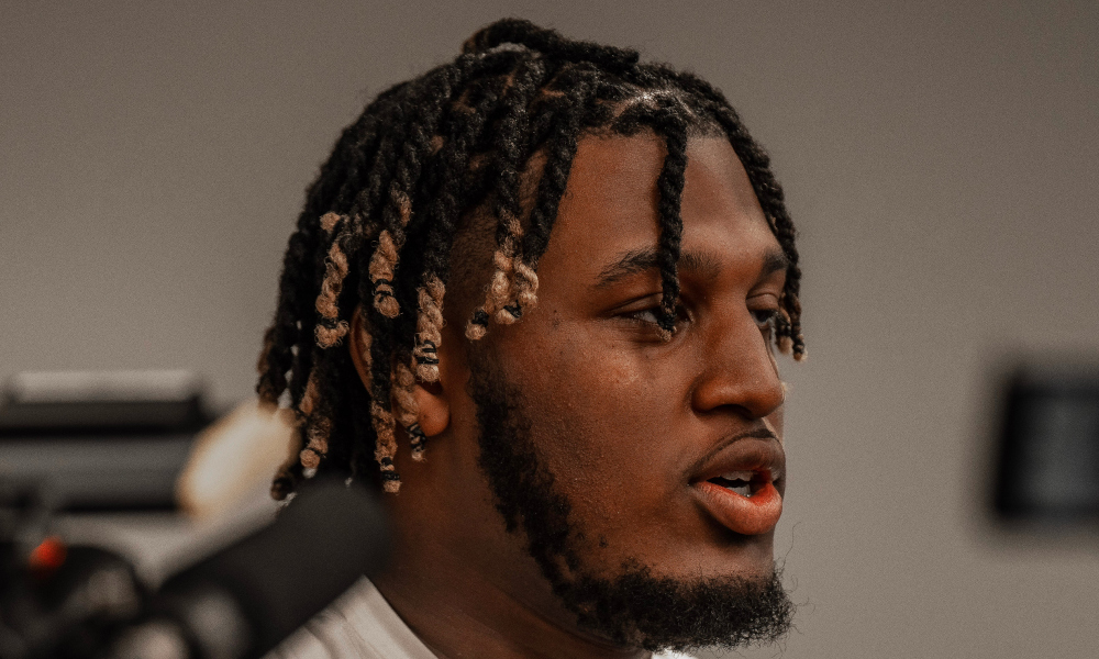 Alabama OT JC Latham (#65) talking to reporters after the Crimson Tide's 2023 spring game.