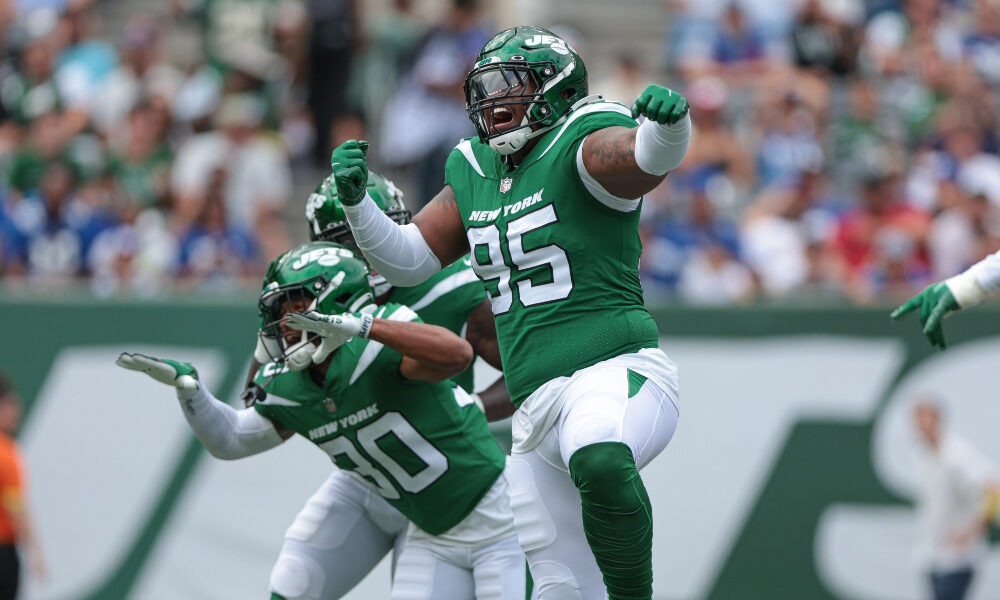 Quinnen Williams celebrates a play with the Jets defense