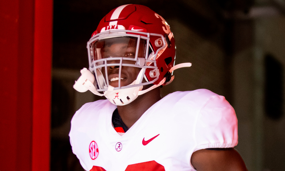 Deontae Lawson runs out of the tunnel against Florida at Ben Hill Griffin Stadium