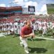 Alabama head coach Nick Sabans runs out onto the field against USF