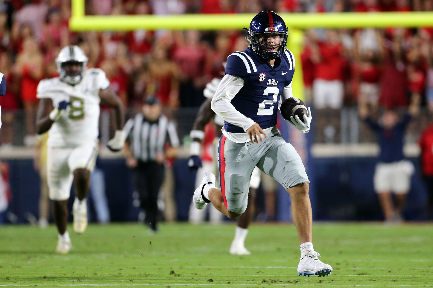 Ole Miss QB Jaxson Dart (#2) runs with the ball inn 2023 matchup against Georgia Tech.