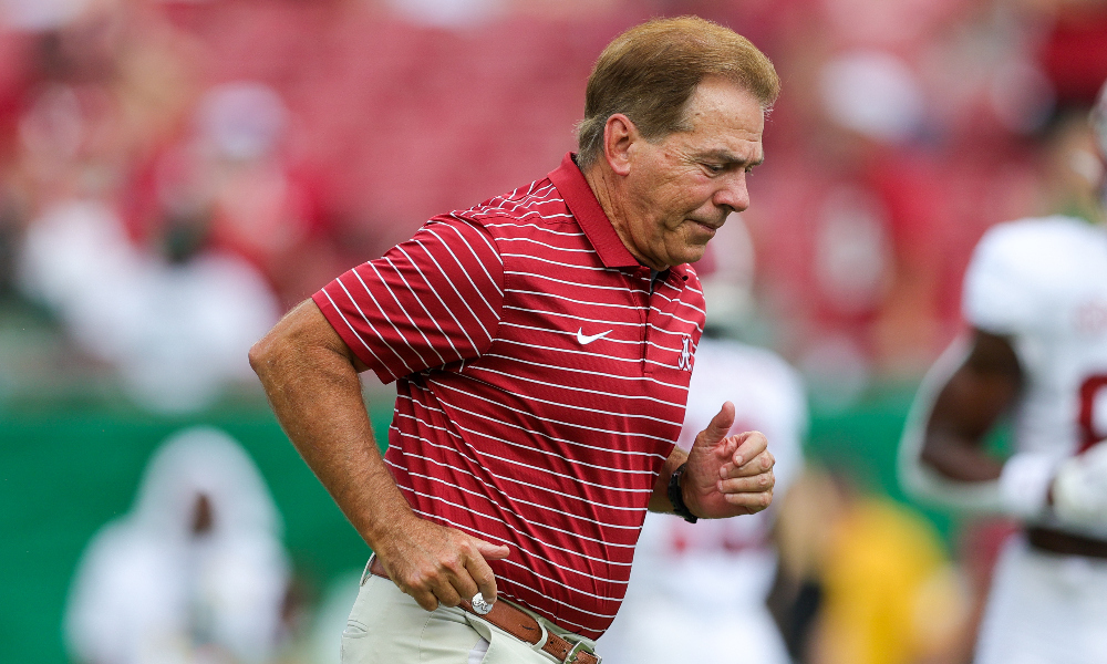 Nick Saban runs onto the field against USF