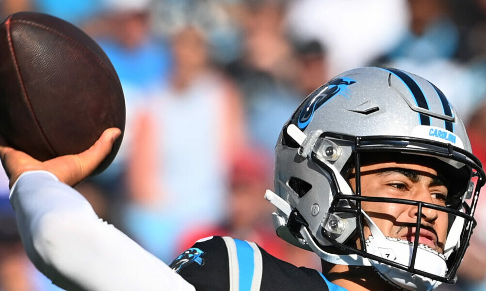 Panthers rookie QB Bryce Young (#9) attempts to throw a pass against Houston Texans.